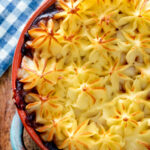 Close up overhead sausage and mash pie.