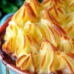 Close up sausage and mash pie.