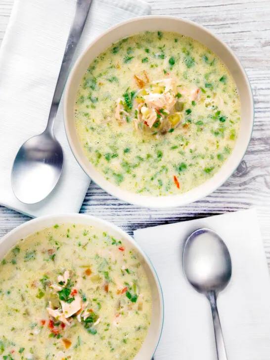 Overhead of two bowls of slow cooker salmon chowder.