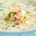 Close up slow cooker salmon chowder featuring a title overlay.