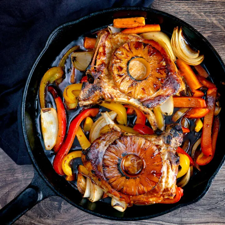 Sweet and sour pork chops with pineapple, onion and peppers.