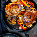 Overhead skillet sweet and sour pork chops with pineapple and peppers featuring a title overlay.