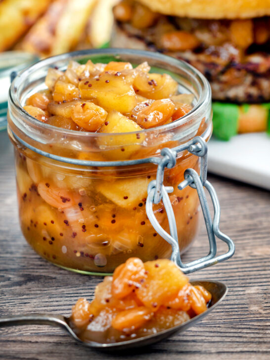 Easy apple chutney with golden raisins served with pork burger.