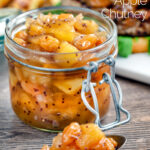 Easy apple chutney with golden raisins served with pork burger featuring a title overlay.