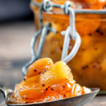 Close up apple chutney with golden raisins.