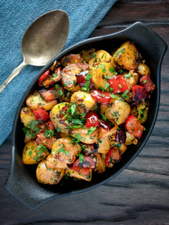 Overhead batata harra Lebanese or Syrian spicy potatoes with red peppers.