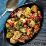 Overhead batata harra Lebanese or Syrian spicy potatoes with red peppers featuring a title overlay.