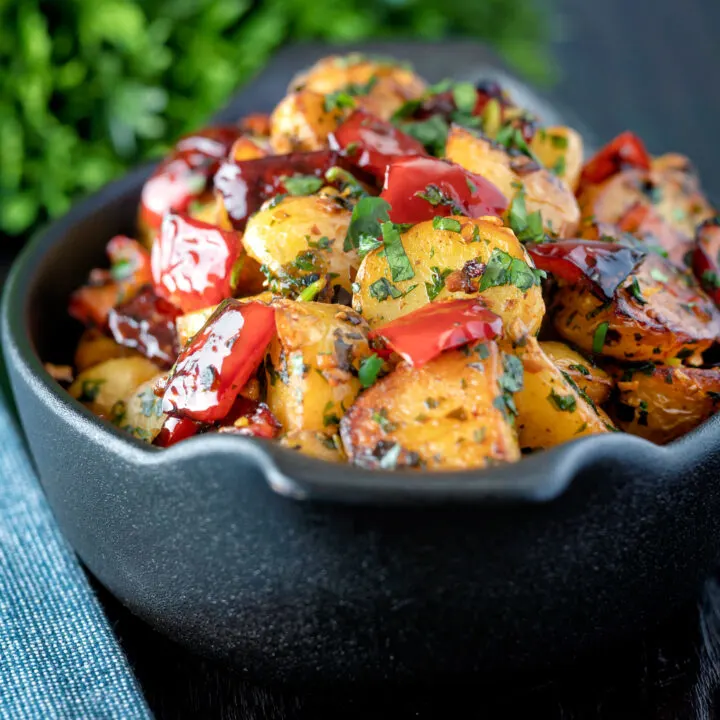 Batata harra Lebanese or Syrian spicy potatoes with red peppers and lemon.