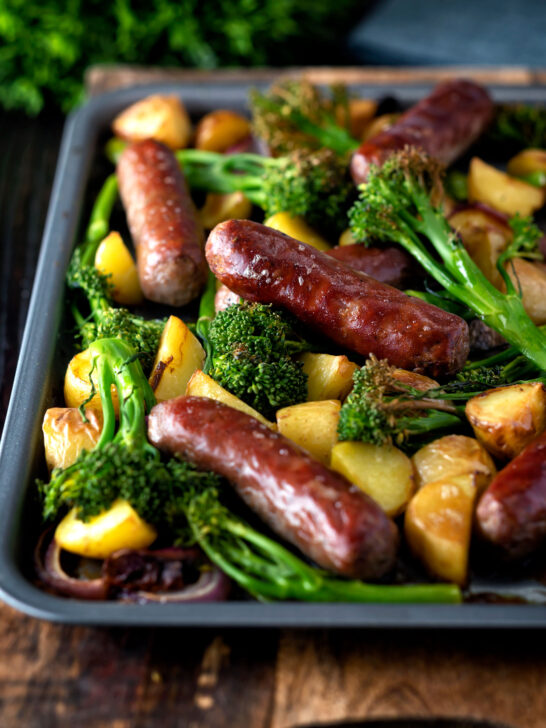 Sausage and potato tray bake with onions and tenderstem broccoli.