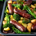 Sausage and potato tray bake with onions and tenderstem broccoli featuring a title overlay.