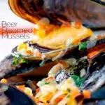 Close up beer steamed mussels with shallot, chilli and garlic featuring a title overlay.