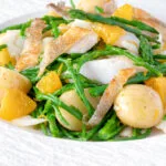Cod fish salad with asparagus, samphire, new potatoes and orange.