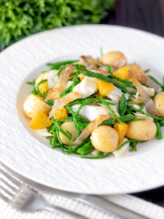 Cod fish salad with asparagus, samphire, new potatoes, crispy fish skin and orange.