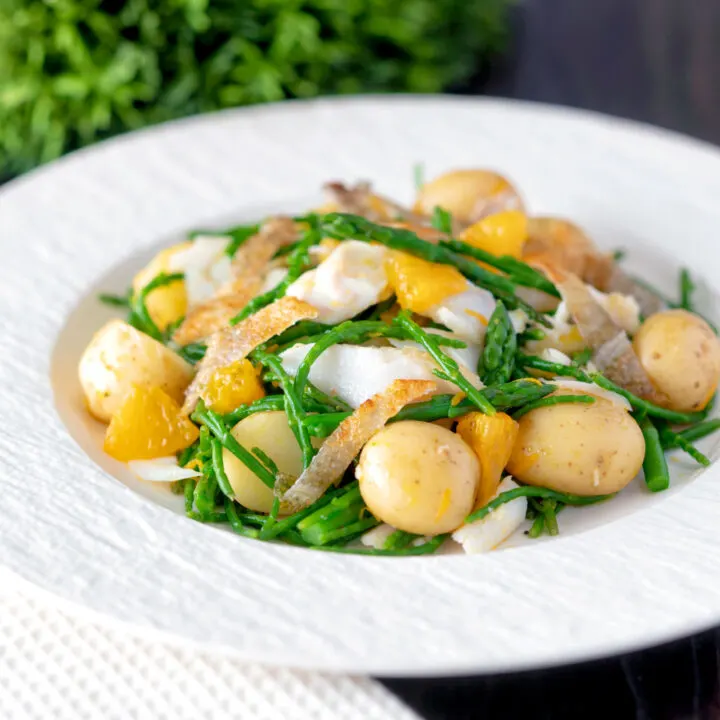 Cod fish salad with asparagus, samphire, new potatoes, crispy fish skin and orange vinaigrette.