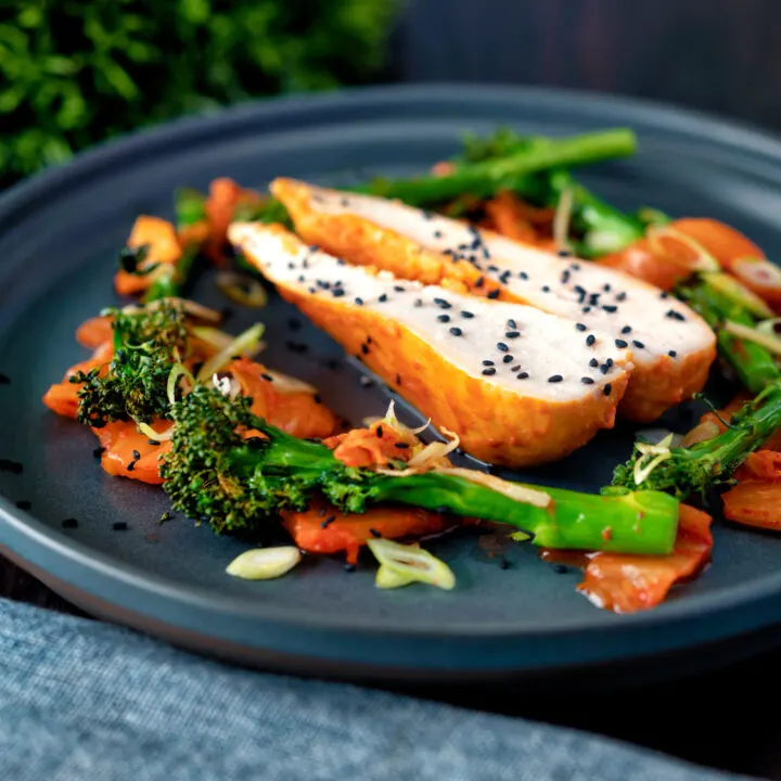 Korean steamed gochujang chicken breast with roasted tenderstem broccoli and kimchi.