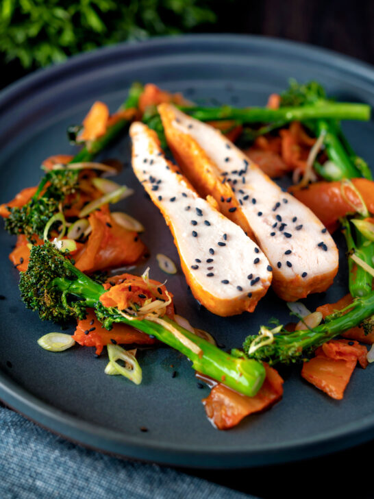 Steamed Korean gochujang chicken breast with broccoli and kimchi.