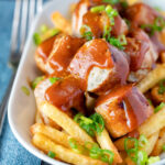Homemade German currywurst with French fries.