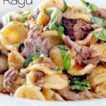 Close up Instant Pot pork ragu with orecchiette pasta served in a white bowl featuring a title overlay.