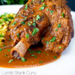 Close up lamb shank curry or nalli gosht served with pilau rice featuring a title overlay.