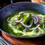 Palak chicken or murgh curry with red onions and cream.