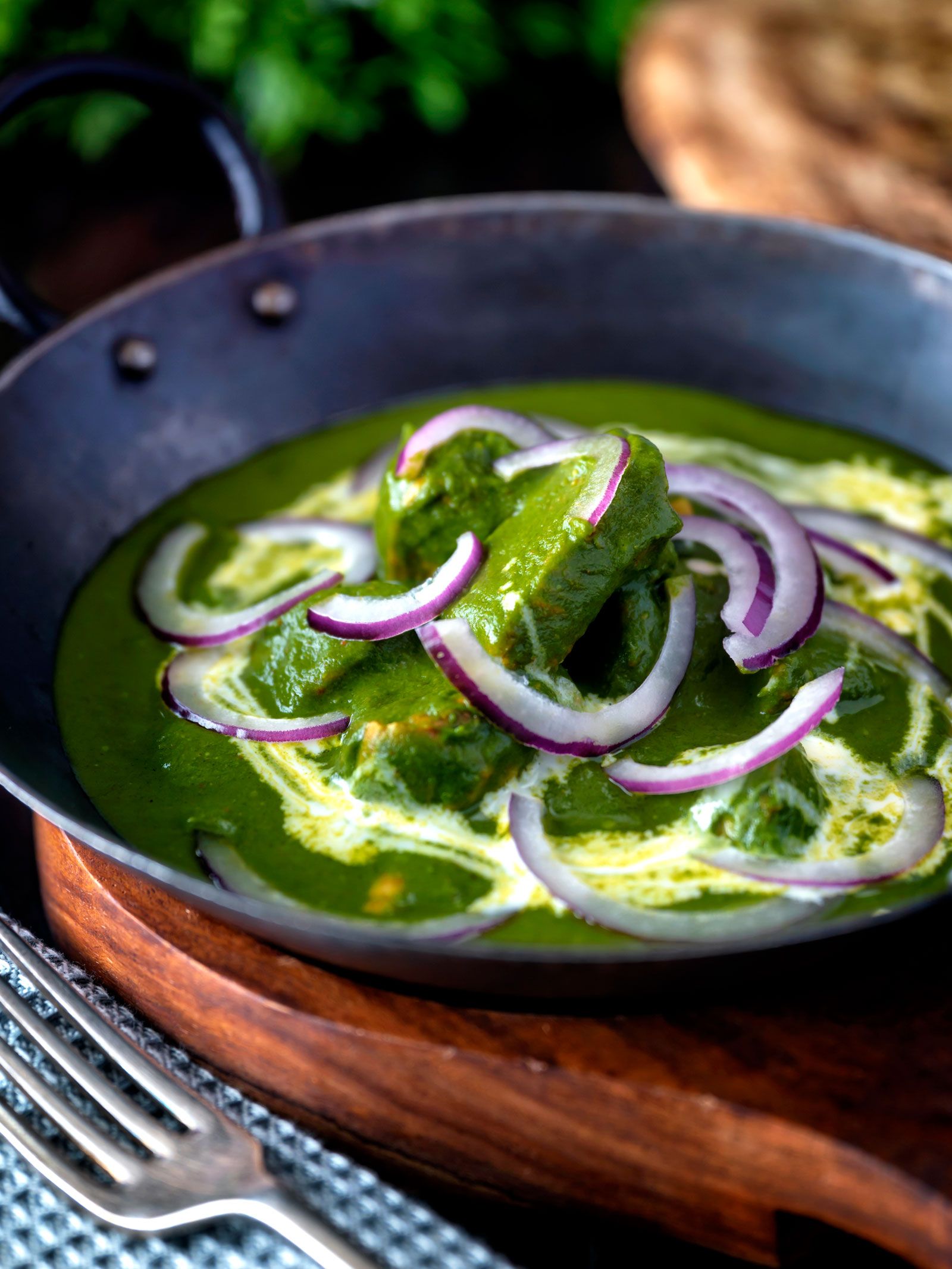 Palak chicken or murgh curry with red onions and cream.