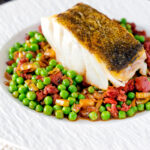 Pan fried cod loin with chorizo sausage, peas and leeks.