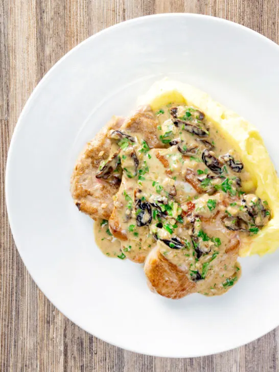 Overhead pork tenderloin with prunes in a brandy cream sauce.