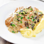 Pork fillet with prunes in a brandy cream sauce.