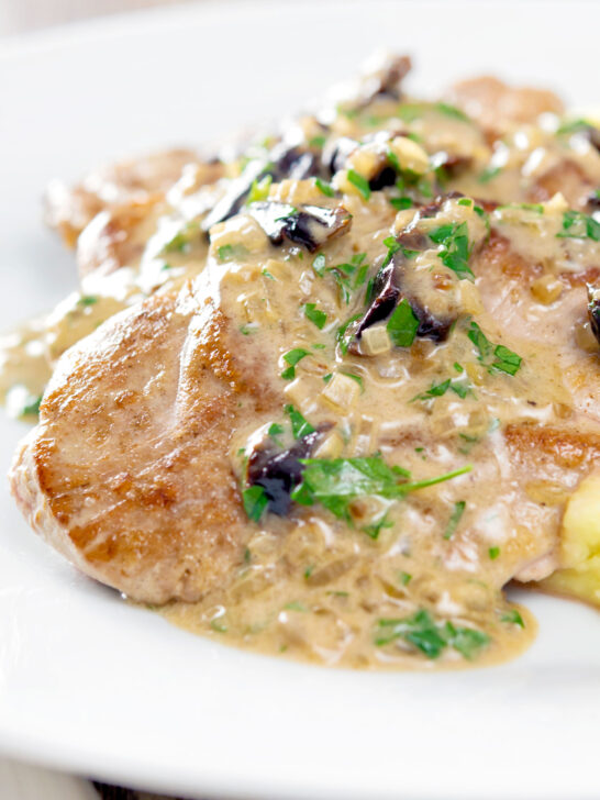 Close up pork tenderloin with prunes in a brandy cream sauce.