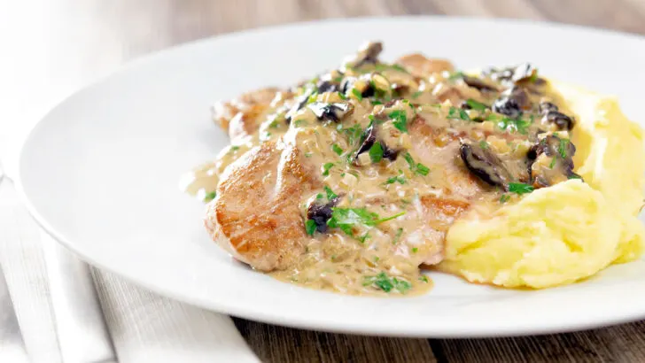 Pork tenderloin with prunes in a brandy cream sauce served with mashed potatoes.