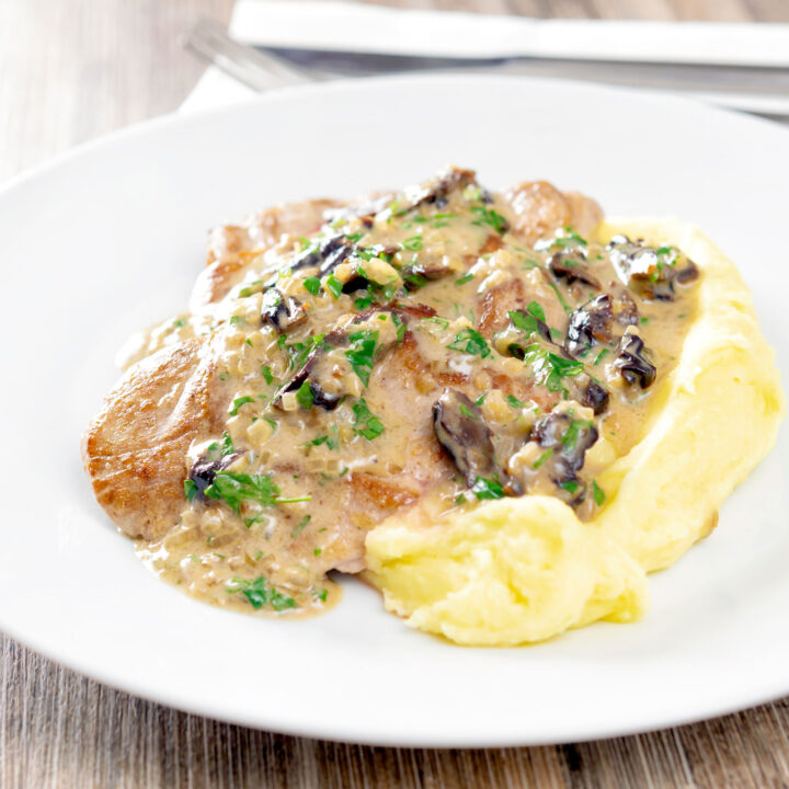 Pork tenderloin with prunes in a brandy cream sauce served with mashed potatoes.