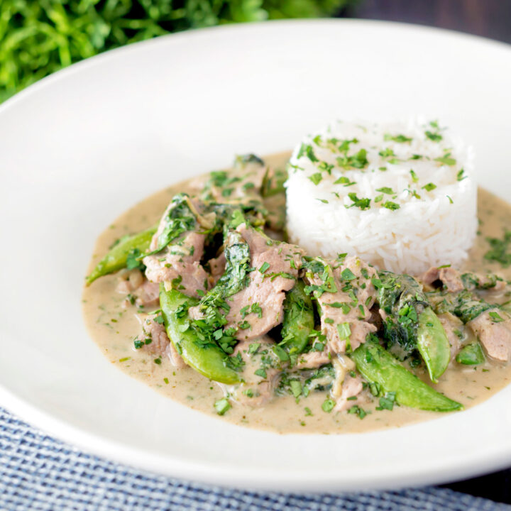 Thai green pork curry served with sugar snap peas and rice.