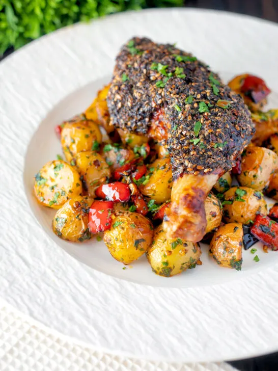 Baked zaatar chicken legs served with spicy Lebanese potatoes.