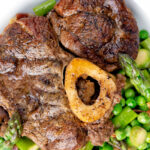Overhead braised beef shin with peas, asparagus and bacon.