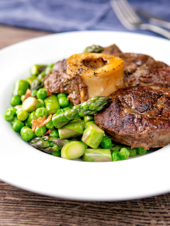 Braised beef shin with peas, asparagus and bacon.