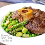 Braised beef shin with peas, asparagus and bacon featuring a title overlay.