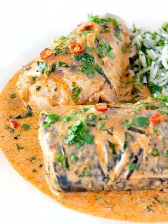 Close up Thai mackerel choo chee curry served with coriander rice.