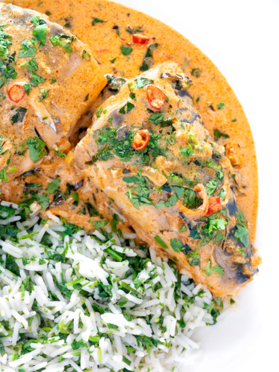 Close up overhead Thai choo chee curry served with coriander rice.