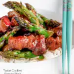 Korean pork belly with a gochujang glaze and asparagus featuring a title overlay.