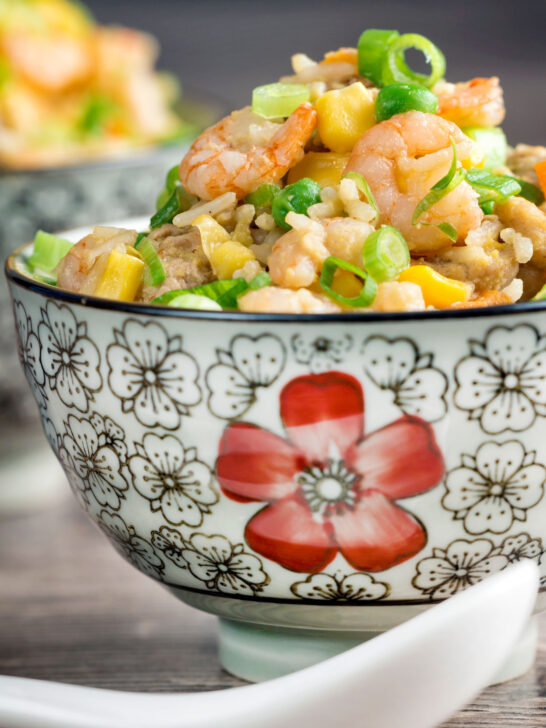 Chinese takeaway style house special fried rice served in a floral bowl.