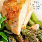 Close up orange marmalade chicken breast served with asparagus featuring a title overlay.