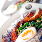 Dutch angle hoisin chicken breast ramen with Swiss chard and a soft boiled egg.