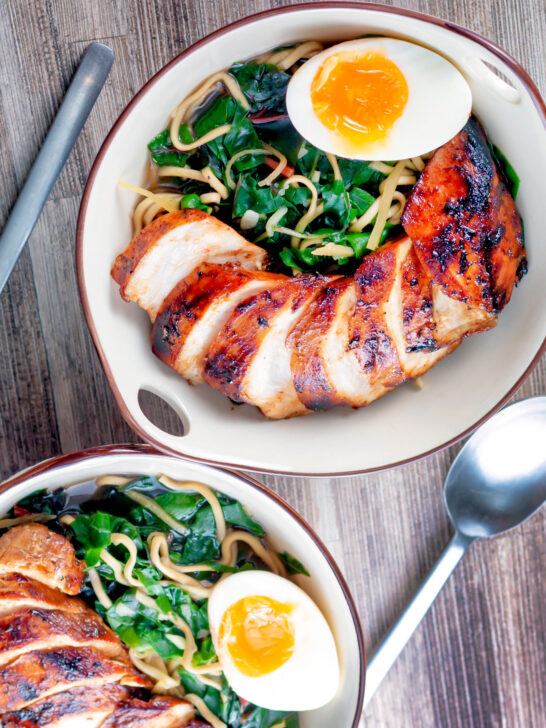 Overhead hoisin chicken breast ramen with Swiss chard and a soft boiled egg.