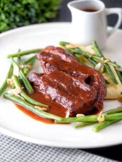 Lamb shoulder chops, red wine and tomato sauce with mash and green beans.