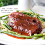 Lamb shoulder chops, red wine and tomato sauce with mash and green beans featuring a title overlay.