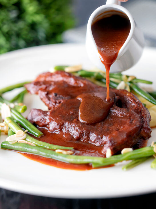 Tomato and red wine sauce poured over lamb shoulder chops.