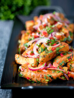 Masala chips or fries topped with onion, tomato, chilli and coriander.