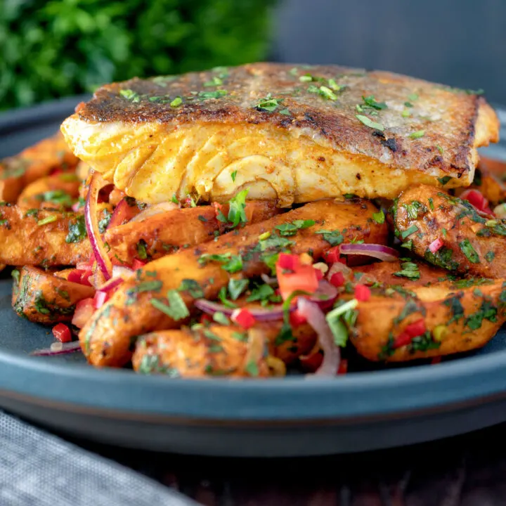 Spicy Indian inspired masala fish fillet (coley) served with masala chips.
