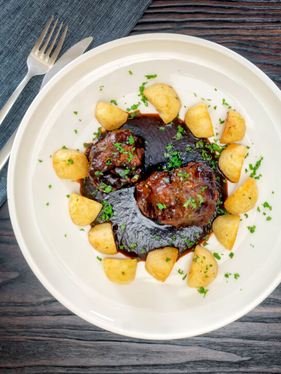 Overhead rabo de toro or Spanish oxtail served with Parmentier potatoes.