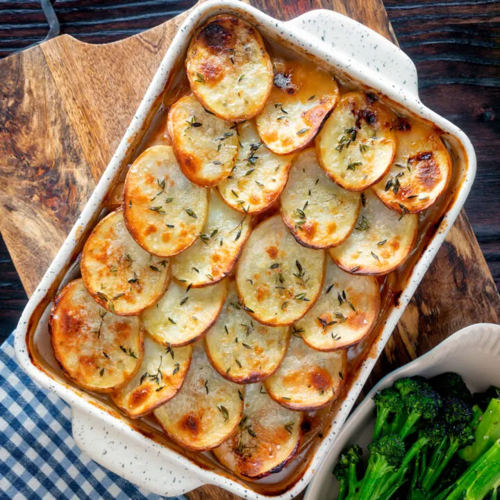 Crispy potato topped sausage hotpot in a casserole dish.